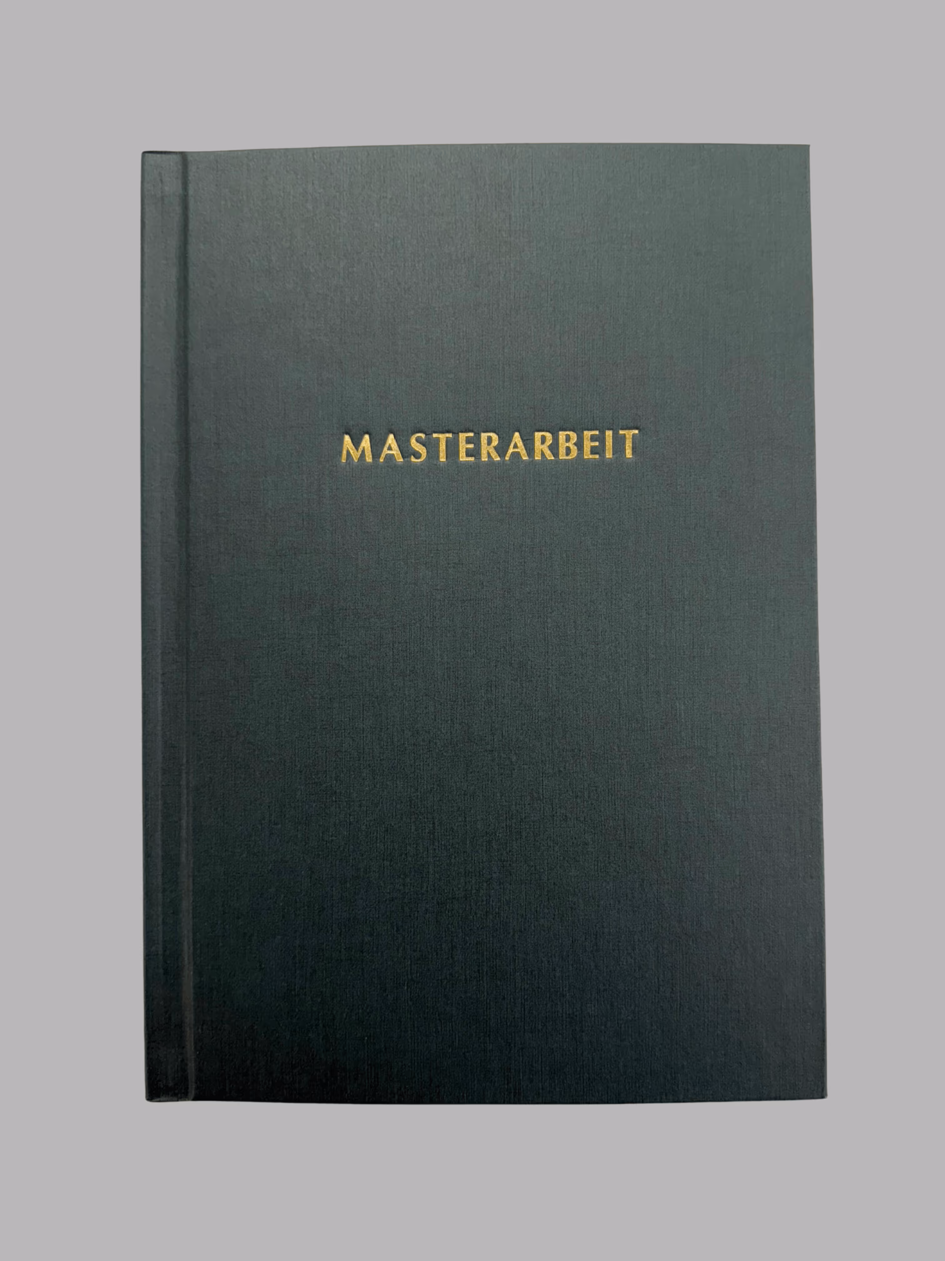 Hardcover book with dark green textured cover embossed with the word 'MASTERARBEIT' in gold letters.